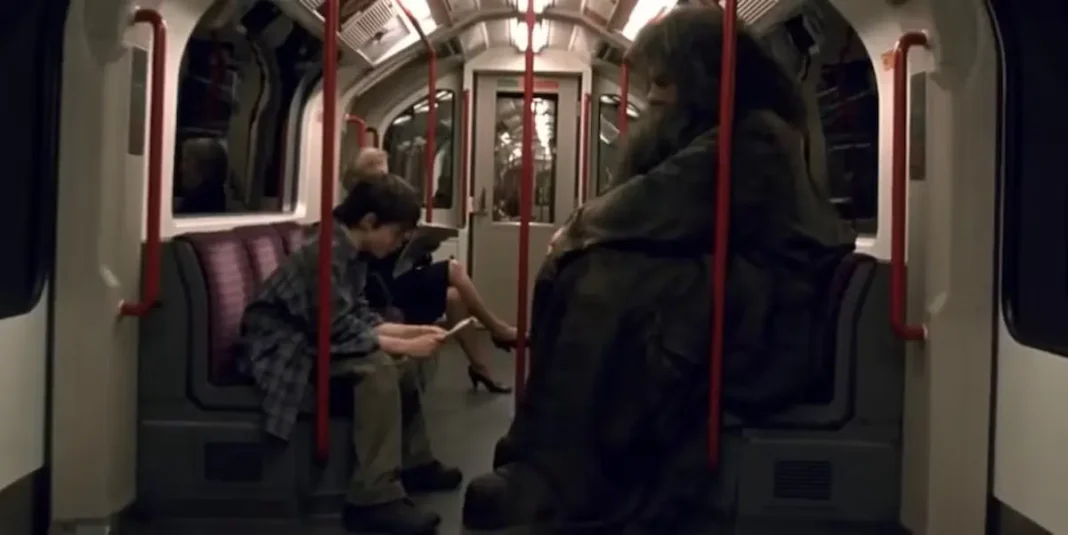 daniel-radcliffe-as-harry-and-robbie-coltrane-as-hagrid-on-the-london-underground-in-harry-potter-and-the-sorcerer-s-stone-2001